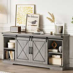 an entertainment center with two doors and shelves