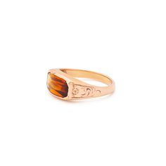 The Story A chic and classic Victorian era ring set with a beautiful citrine sitting front and center. Constructed from 14k rose gold, the long faceted stone measures 12.2 mm by 6.3 mm. Set flush with the setting, the pieces has a sleek, uniform look and feel. The back is open allowing light to pour through, making the stones color pop. Beautiful hand enraged floral detailing finishes the ring perfectly. The simple, yet classic construction is all this ring needs. We love it worn on its own, paired with other pieces, or stacked with your favorite rings. The Specs Style Number: R3536 Victorian, 1890s-1900 14 karat rose gold Citrine measures 12.2 x 6.3 mm Height of front face of ring 0.37", depth of ring as it sits off finger 0.13", width of entire ring 0.76" Band width tapers from 3.7 mm do Classic Rose Gold Topaz Ring For Formal Events, Classic Rose Gold Topaz Ring For Formal Occasions, Classic Rose Gold Topaz Ring, Elegant Citrine Signet Ring For Formal Occasions, Elegant Formal Citrine Signet Ring, Classic Formal Rings With Faceted Details, Classic Formal Faceted Rings, Elegant Citrine Signet Ring With Gemstone, Elegant Citrine Gemstone Signet Ring