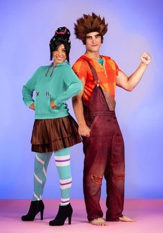 two people dressed in costumes standing next to each other