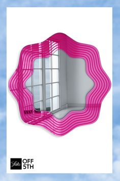 a mirror with pink wavy lines on it and the sky in the backround