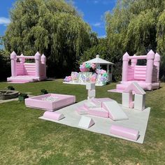 pink and white inflatable furniture set up on the lawn