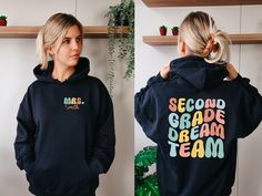 Second Grade Dream Team Hoodie, Personalized Teacher Hoodie, Custom Second Grade Teacher Hoodie, Custom Teacher Name Hoodie, Back To School 💖Youth Hoodies do not have drawcord for added safety!💖 Material: 50% cotton, 50% polyester for a comfortable and durable blend. Fabric: Medium-heavy (8.0 oz/yd² or 271.25 g/m²) for warmth on cooler days. Fit: Loose fit for comfort without sacrificing style. Label: Sewn-in for a seamless feel. Sizing: Check our sizing chart for the right fit. HOW TO PLACE Y School Hoodie With Drawstring Hood, Long Sleeve Hoodie With Ribbed Cuffs For School, Black Hooded School Hoodie, Black Hooded Hoodie For School, School Hoodie Sweatshirt With Drawstring Hood, Hooded Hoodie With Drawstring For School, Hoodie Back, Hoodie Personalized, Second Grade Teacher