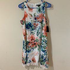 Light Ivory With Floral Print And Lace Trim On Hem. Zipper On Back. Shoulder To Shoulder Is 10”, Pit To Pit Is 18”. Total Length 36”. Sleeveless Mini Dress With Floral Print, Robert Louis, Light Ivory, Back Shoulder, Lace Trim, Sleeveless Dress, Colorful Dresses, Floral Print, Floral Prints