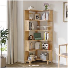 a bookshelf filled with lots of books in a living room next to a window