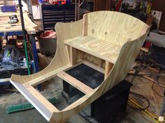 a wooden chair being built in a workshop