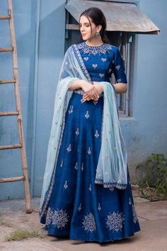 Blue lehenga with embroidered floral motifs. Comes with blouse and sheer dupatta.
Components: 3
Fabric: Raw silk, Net
Neckline: Round
Sleeve Length: Elbow
Color: Blue
Embroidery
Hand embroidery
Embroidered floral motifs on blouse
Embroidered floral motifs on dupatta
Side tassel tie-up detail on lehenga - Aza Fashions Traditional Blue Gown For Wedding, Blue Raw Silk Dress With Zari Work, Fitted Blue Lehenga With Intricate Embroidery, Blue Raw Silk Dresses For Festivals, Blue Raw Silk Dress For Eid, Blue Embroidered Gown With Traditional Drape, Embroidered Floor-length Dola Silk Set, Blue Art Silk Dress With Intricate Embroidery, Blue Dress With Intricate Embroidery For Diwali