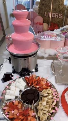 a table topped with lots of different types of desserts and candy bars on top of plates