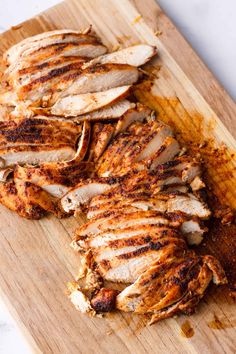 sliced chicken on a wooden cutting board