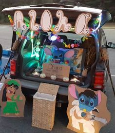 the trunk of a car decorated with items from disney's animated movie, stitch