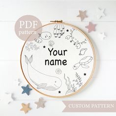 a cross stitch pattern with the words, your name and some stars around it on a white background