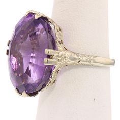 Amethyst & White Gold RingSpecifications:Metal: 14K White GoldStone: AmethystStone Weight: 17.25ctStone Size: 18x14mmStone Grade: AAAStone Shape: OvalWeight Total: 6.49gRing Size: 7.5 *Please indicate your ring size at checkout. **Complementary sizing for rings purchased on our website. Classic Oval Purple Amethyst Ring, Elegant Purple Amethyst Ring With Large Stone, Formal Lavender Amethyst Ring With Oval Shape, Formal Lavender Oval Amethyst Ring, Classic Large Stone Amethyst Ring For Formal Events, Formal Amethyst Ring With Large Stone, Oval Purple Amethyst Ring, Classic Formal Amethyst Ring With Large Stone, Formal Lavender Oval Ring