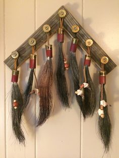 a group of feathers hanging on a wall