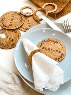 place setting with personalized wooden coasters and napkin