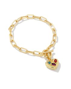 We’re falling for the Penny Gold Heart Chain Bracelet in Multi Mix—and you will, too! Bold and with the perfect amount of sparkle, this bracelet’s paperclip chain features a crystal-studded heart charm. If you aren’t obsessed already, the charm can be removed, letting you personalize your style from day to night or look to look. Metal 14k Gold Over Brass Material Gray Blue Crystal, Red Crystal, Violet Crystal Closure Toggle Size 7"L, 0.52"WDue to the one-of-a-kind nature of the medium, exact col Kendra Scott Chantal Bracelet, Kendra Scott Charm Bracelet, Penny Bracelet, Heart Chain Bracelet, Short Pendant Necklace, Gold Charm Bracelet, Dope Jewelry, Heart Chain, Jewelry Lookbook