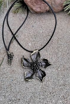 "GH42-I love this piece....Pretty bronze colored zinc alloy metal flower that measures 2\" X 2\".  I have attached a black 1.5mm rolled leather cord with antique bronze findings and bronze lobster clasp measuring approximately 20\" in length.  Nice birthday or mother's day gift." Bronze Necklace, Metal Flower, Wood Necklace, Metal Flowers, Bronze Color, Flower Necklace, Piercing Jewelry, Leather Cord, Necklace Pendant