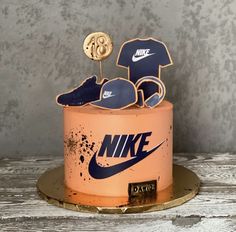 a cake decorated with the nike logo and other items