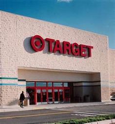 a target store is shown with the sign on it's front door and people walking outside