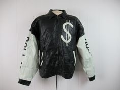 "Vintage 1990s iconic jacket. Made of butter soft black and white leather. Has dollar sign, Dollar Dollar and money bag on the back. Hip hop treasure from Wu-Tang Clan C.R.E.A.M. Has a zip front, two waist pockets and inner pocket. Size XXL. Actual measurements are: 54\" at the chest 47\" at the unstretched waist 30\" shoulder seam to shoulder seam 21.5\" shoulder seam to cuff 28\" overall length In excellent unused condition with original hang tag. Has a couple small 1/4\" rub spots that would 90s Style Leather Jacket For Winter Streetwear, 90s Style Leather Jacket For Fall Streetwear, Retro White Leather Jacket With Long Sleeves, White Retro Leather Jacket With Long Sleeves, White Leather Biker Jacket For Streetwear, White Retro Long Sleeve Leather Jacket, White Leather Streetwear Jacket, White Leather Streetwear Outerwear, White Leather Outerwear For Streetwear