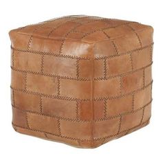 a square leather ottoman with braiding on the sides and an open end, in light brown