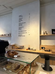 breads and pastries on display in a bakery