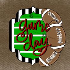 some footballs are laying on top of each other with the word game day written in red