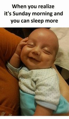 a baby smiling and holding its head in his arms with the caption, when you relize it's sunday morning and you can sleep more