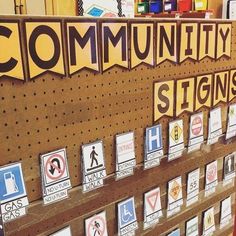 there are many signs on the pegboard in this store that say, community signs