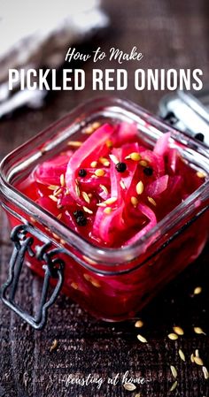 pickled red onions in a glass container with seeds on the side and text overlay that reads how to make pickled red onions