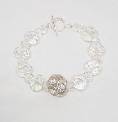 Clear faceted AB crystals and rhinestones with silver plated toggle clasp make up this blingy bracelet to wear alone or stack with your favorite bracelets. Crystals:  6x8 and 10x14mm Length:  7.5" Free Shipping on orders of $35 or more Vero Beach Fl, Vero Beach, Crystal Ab, Rhinestone Bracelet, Bead Jewelry, Toggle Clasp, Favorite Jewelry, Beaded Jewelry, Silver Plated