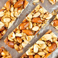 nuts and almonds are arranged on top of each other to make granola bars