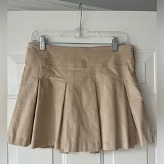 Unworn. A True Medium Size. Material Is Velvety. Fitted Beige Flared Skirt Skort, Beige Fitted Cotton Pleated Skirt, Fitted Beige Cotton Pleated Skirt, Kakhi Skirt, Beige Pleated Skirt, Beige Mini Skirt, Plain Skirt, Tan Skirt, Beige Skirt