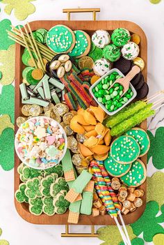 a platter filled with lots of different types of treats and candies for st patrick's day