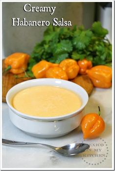 a bowl of creamy habanero salsa next to some vegetables