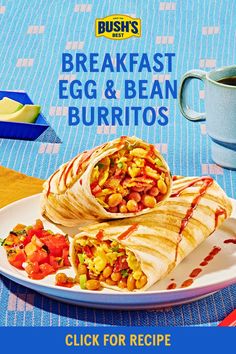 a breakfast burrito with beans and vegetables on a plate next to a cup of coffee