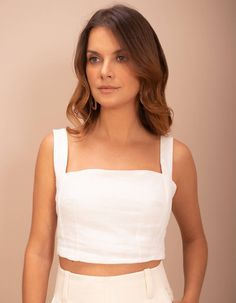 Cropped top with square neckline and straps in cut-out shapes and strategically placed darts to contour the silhouette. Elastics on the back for comfort and practicality when wearing.100% linen fabric providing freshness with a slight rustic touch due to its natural appearance.Composition: 100% linen.Model wears size S. Model measurements: Height - 169cm. Bust - 84cm. Waist - 68cm. Hip - 94cm.Care of the piece: The piece is made of 100% linen fabric, a natural fabric that requires a lot of care Linen Crop Top, Cut Out Shapes, Natural Fabric, Square Necklines, Cropped Top, Natural Fabrics, Square Neckline, Model Measurements, Linen Fabric