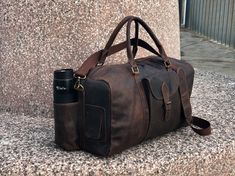 "Genuine Leather Travel Duffel Bag. PURE LEATHER: Bags are made of full grain genuine leather. Vintage inspired design combined with the distressed leather gives a rich classy look. WITH SHOE POUCH: The travel duffel bag is useful in daily travel, The shoe compartment is convenient to store a pair of shoes. WITH BOTTLE HOLDER: One pocket on the right side are sized to fit a water bottle( 800ml) SIZE: 20''x 10'' x 10\", Exterior side pockets slot designed for easy access to stow your Shoes, Open Leather Travel Bag With Waxed Finish For Daily Use, Leather Satchel Travel Bag With Waxed Finish, Leather Bags With Large Capacity For Outdoor, Leather Bags With Luggage Sleeve For Outdoor, Leather Tote Travel Bag With Waxed Finish, Daily Use Leather Travel Bag With Waxed Finish, Outdoor Large Capacity Leather Bags, Leather Travel Satchel Bag For Outdoor, Leather Satchel Travel Bag For Outdoor