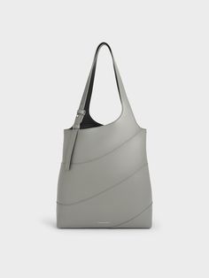 This season, pick grey as your go-to neutral hue -- this Trin tote bag in light grey is a great piece to start with. Featuring clean lines and a panelled exterior, this roomy carrier proves that less can be more. With a spacious interior that can hold everything you’ll need in a day and more, it also comes with a detachable pouch that will help to keep your most-used items easily accessible. Charles Keith, Clean Lines, Trending Shoes, Light Grey, To Start, Shoe Bag, Pouch, Tote Bag, Exterior