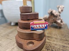 a wooden toy train is stacked on top of each other