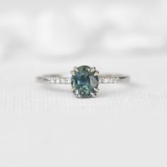 Devon Windsor Engagement Ring, Oval Green Diamond Ring, Gia Certified Oval Sapphire Ring For Anniversary, Gia Certified Oval Sapphire Anniversary Ring, Gia Certified Green Oval Sapphire Ring, Modern Oval Sapphire Ring With Prong Setting, Gia Certified Oval Sapphire Ring, Modern Oval Sapphire Ring With Accent Stones, Modern Sapphire Rings Gia Certified