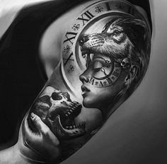 a man's arm with a clock and wolf on it