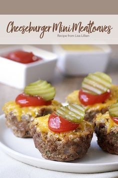 mini meatloafs with ketchup and pickles on a white plate