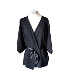 Diane von Furstenberg kimono top 100 % silk. The wrap blouse has kimono sleeves, hidden tie closure and exterior belt loops / the belt is not original you can make it your own statement piece/, otherwise in very good condition. Size 8 US, L international. Flat measurements: armpit to armpit - 60 cm/ 23.6'' sleeve /neckline to cuff/ - 41 cm/ 16.1" length / back of neck to hem/ - 76 cm/ 29.9'' Chic Kimono With Tie Waist And Kimono Sleeves, Chic Wrap Kimono For Daywear, Black Kimono With Kimono Sleeves For Work, Chic Evening Wrap Kimono, Black Wrap Top For Workwear, Black Wrap Top For Work, Chic Belted Wrap Kimono, Chic Workwear Kimono With Kimono Sleeves, Chic Kimono With Kimono Sleeves For Work