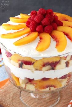 a layered dessert with fruit on top