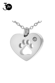 a heart shaped pendant with a paw print on it