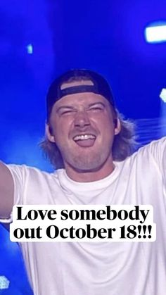 a man in white shirt and black hat holding his arms up to the side with words above him