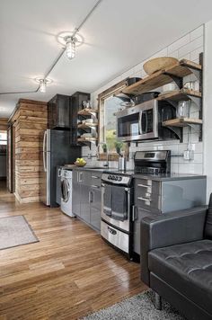 the kitchen is clean and ready to be used as a living room or dining area