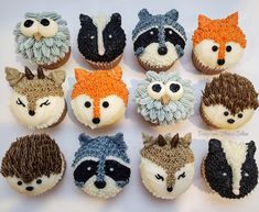 cupcakes with frosting made to look like foxes and raccoon heads