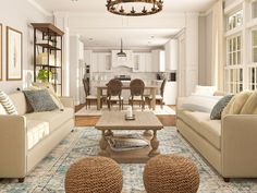 a living room filled with furniture next to a dining room table and chairs on top of a rug