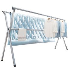 an ironing board with clothes hanging on it