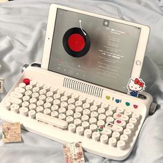 an old fashioned computer with a hello kitty sticker on the keyboard